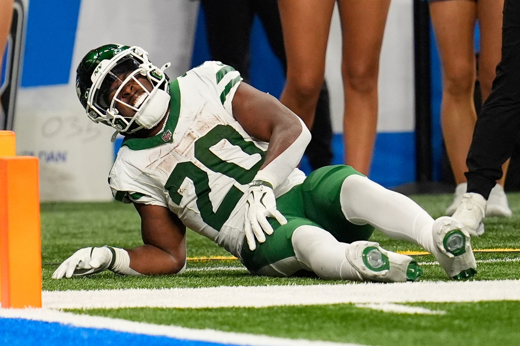 New York Jets' Breece Hall is injured during the second half of an NFL football game against the Detroit Lions in Detroit, Sunday, Sept. 27, 2026. (AP Photo/Paul Sancya)