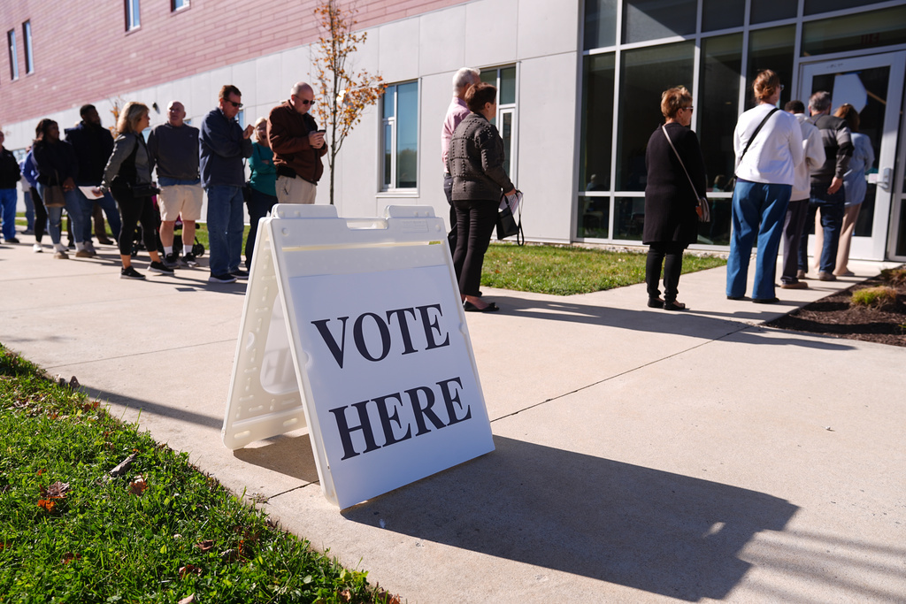 FILE - Voters wait in line to cast their ballot at a polling place at Rowan College in Mt Laurel, N.J., Oct. 27, 2025. (AP Photo/Matt Rourke, File)
