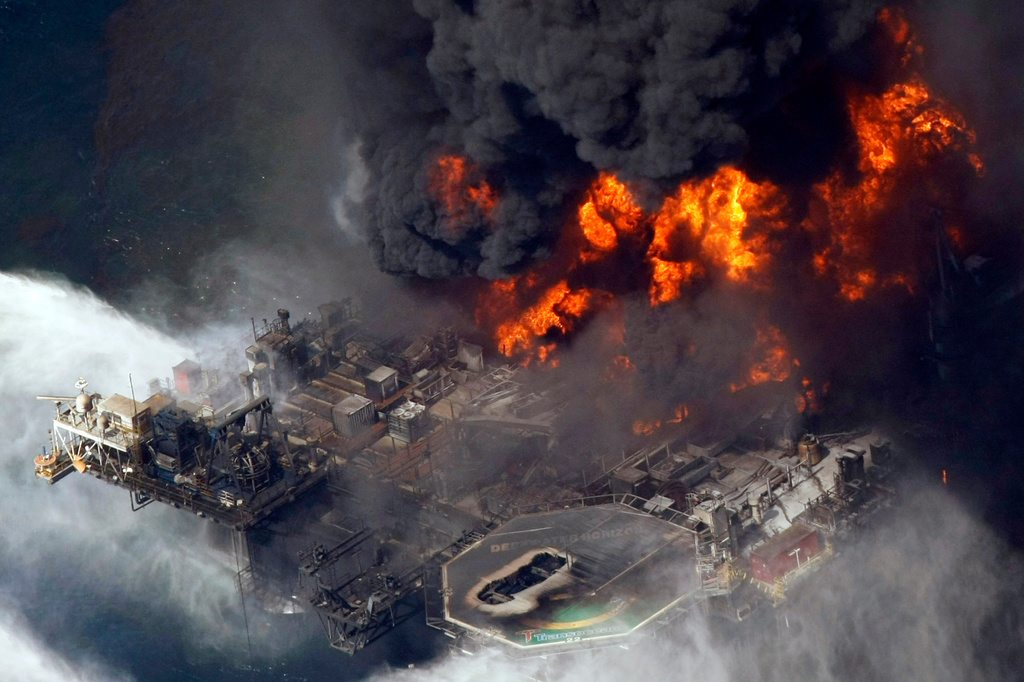 FILE - The Deepwater Horizon oil rig burns on April 21, 2010, in the Gulf of Mexico, more than 50 miles southeast of Venice, La. (AP Photo/Gerald Herbert, File)