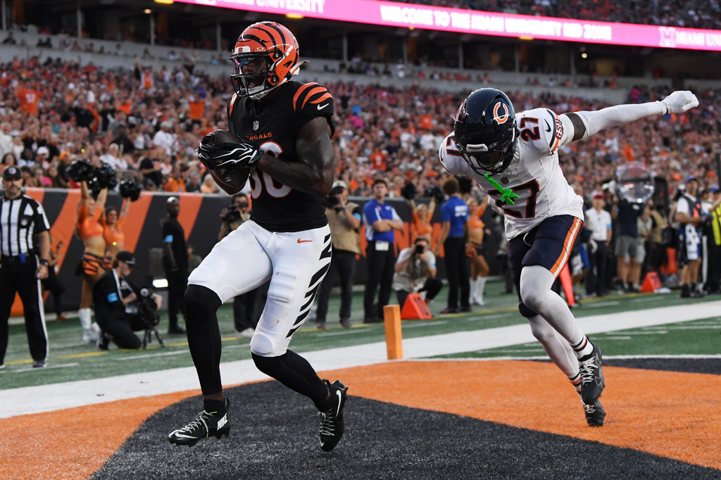 Cincinnati Bengals wide receiver Colbie Young scores a touchdown in front of Chicago Bears defensive back Dontae Manning (27) during the first half preseason NFL football game Saturday, Aug. 22, 2026, in Cincinnati. (AP Photo/Tanner Pearson)