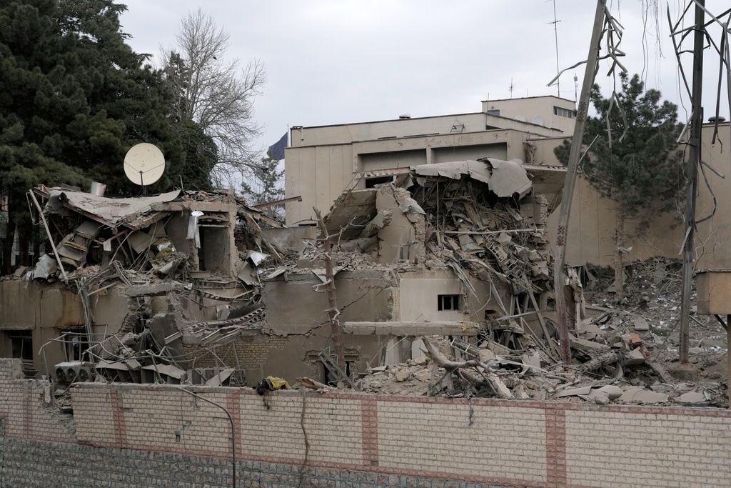 A state TV communications tower and building destroyed Sunday during a strike as part of the ongoing joint U.S.–Israeli military campaign are seen in Tehran, Iran, Monday, March 2, 2026. (AP Photo/Vahid Salemi)