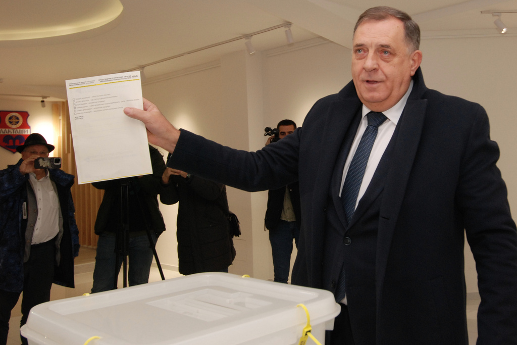 Bosnian Serb leader Milorad Dodik casts his ballot in a snap presidential election of Republika Srpska at a polling station in Laktasi, northwest of Sarajevo, Bosnia, Sunday, Nov. 23, 2025. (AP Photo/Radivoje Pavicic)