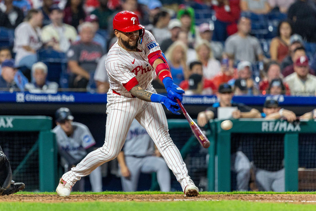 Philadelphia Phillies' Edmundo Sosa hits his third home run of the game during the seventh inning of a baseball game against the Miami Marlins, Wednesday, Sept. 24, 2025, in Philadelphia. (AP Photo/Laurence Kesterson)