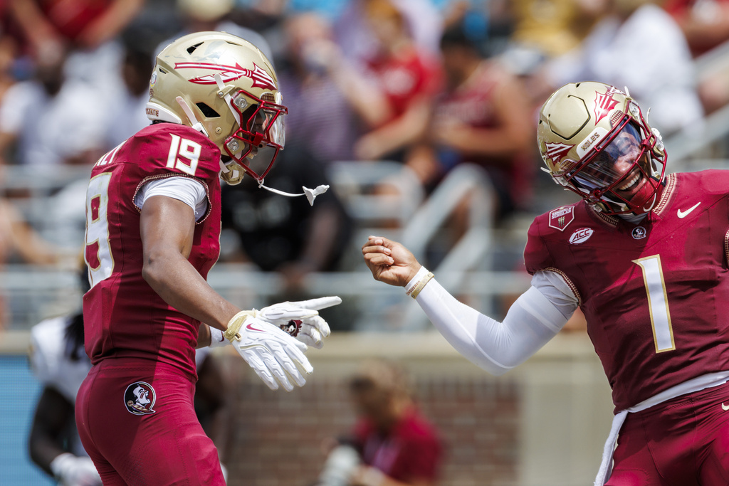 Florida State wide receiver Micahi Danzy (19) celebrates his touchdown with quarterback Tommy Castellanos (1) during the first half of an NCAA college football game against East Texas A&M, Saturday, Sept. 6, 2025, in Tallahassee, Fla. (AP Photo/Colin Hackley)