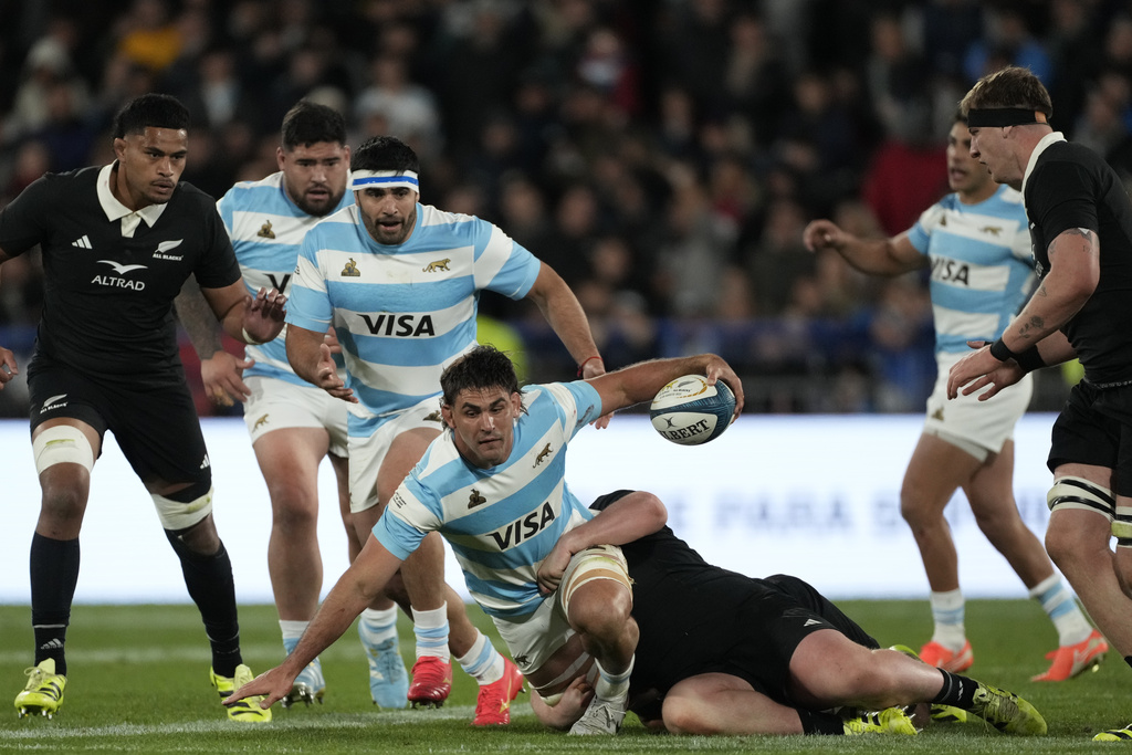 Argentina's Los Pumas Pablo Matera is tackled by New Zealand's All Blacks Fletcher Newell during a rugby championship match in Buenos Aires, Argentina, Saturday, Aug. 23, 2025. (AP Photo/Gustavo Garello)