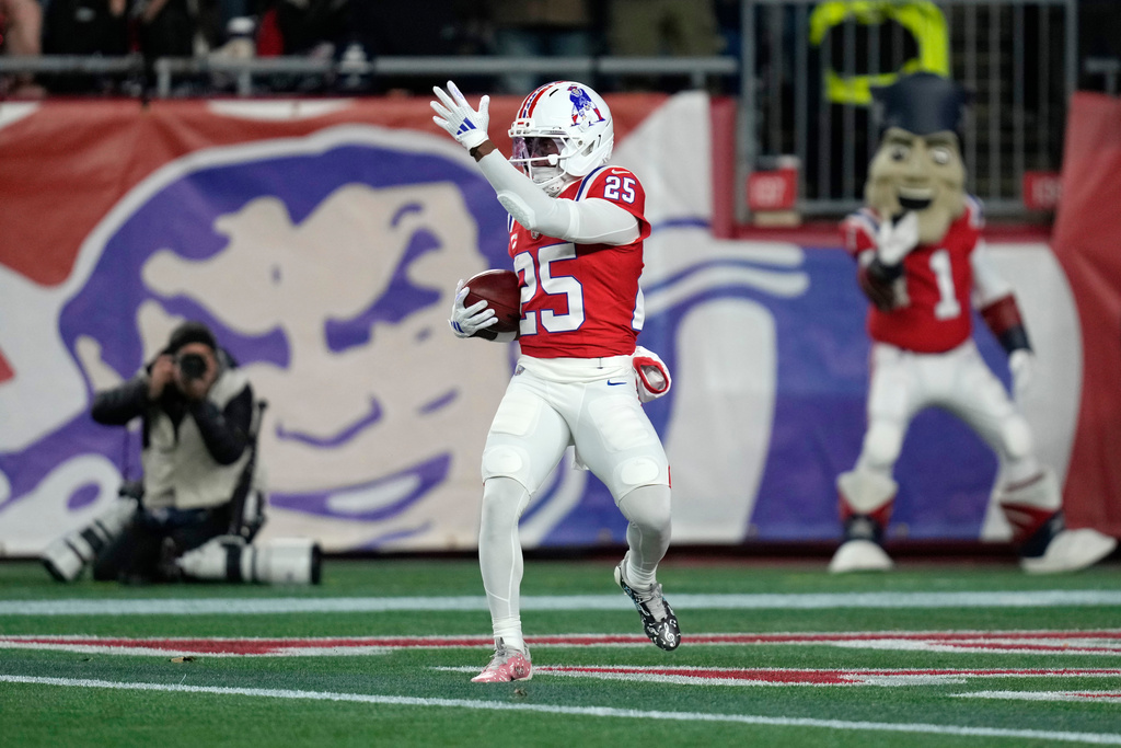 New England Patriots cornerback Marcus Jones celebrates a punt return for a touchdown against the New York Giants during the first half of an NFL football game, Monday, Dec. 1, 2025, in Foxborough, Mass. (AP Photo/Charles Krupa)