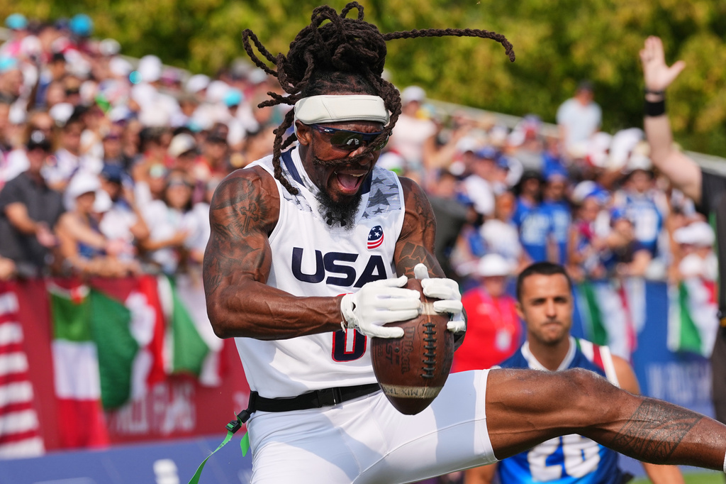 United States' Tyler "TD" Davis celebrates a touchdown during the Flag Football World Championship men's final game between Italy and USA in Duesseldorf, Germany, Sunday, Aug. 16, 2026. (AP Photo/Martin Meissner)
