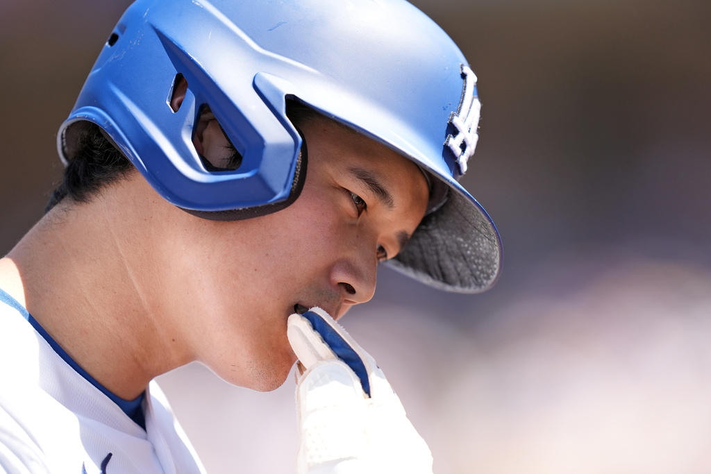 Los Angeles Dodgers' Shohei Ohtani heads back to the dugout after being forced out at second base by the Miami Marlins during Freddie Freeman's double play in the seventh inning of a baseball game Wednesday, April 29, 2026, in Los Angeles. (AP Photo/Scott Strazzante)