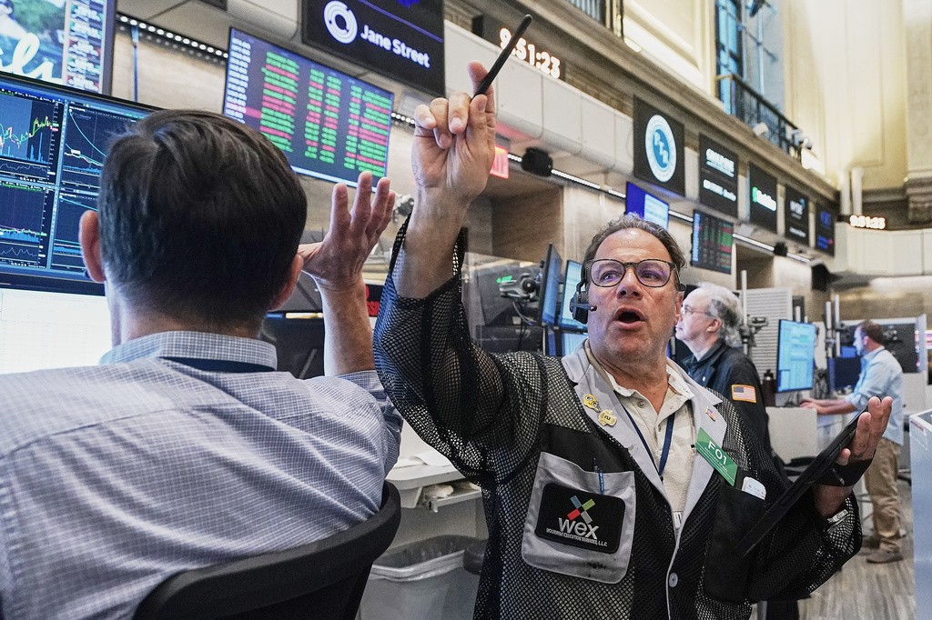 Options trader Anthony Spina, center, works on the floor of the New York Stock Exchange, Tuesday, June 16, 2026. (AP Photo/Richard Drew)