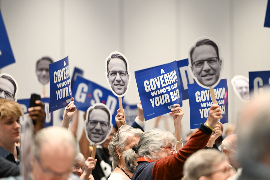 FILE - The crowd reacts to Pennsylvania Gov. Josh Shapiro while he speaks at a Centre County Democratic Party event at the Penn Stater hotel, April 11, 2026, in State College, Pa. (AP Photo/Marc Levy, File)