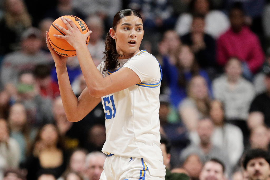 FILE - UCLA center Lauren Betts (51) controls the ball during the first half against LSU in the Elite Eight of the NCAA college basketball tournament, Sunday, March 30, 2025, in Spokane, Wash. (AP Photo/Young Kwak, File)