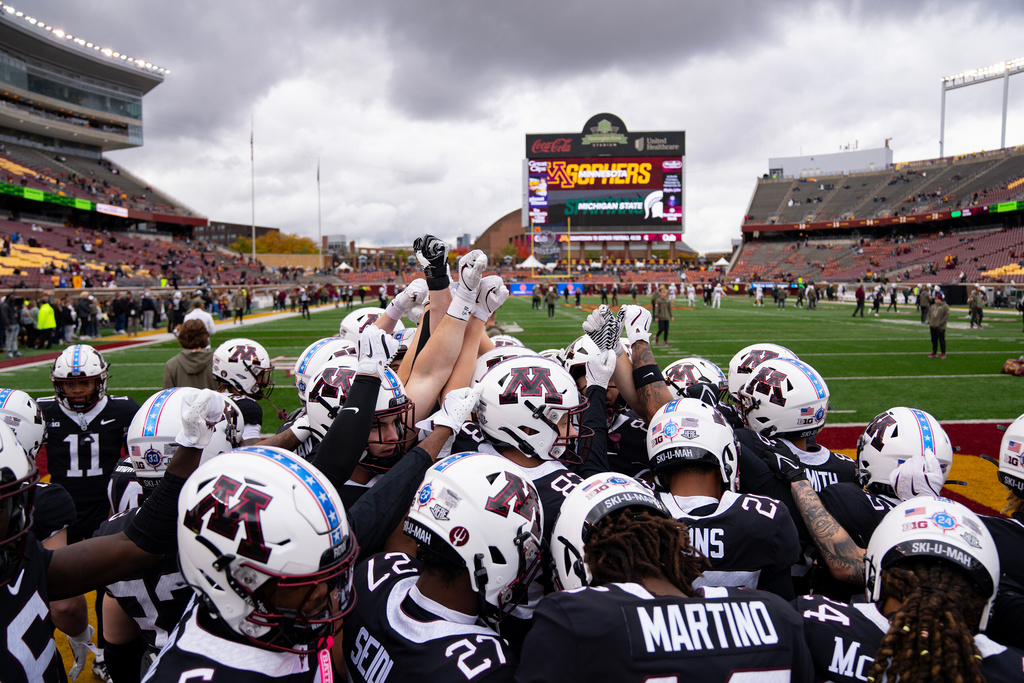 Minnesota players huddle on the field ahead of an NCAA college football game against Michigan State, Saturday, Nov. 1, 2025, in Minneapolis, Minn. (Alex Kormann/Star Tribune via AP)