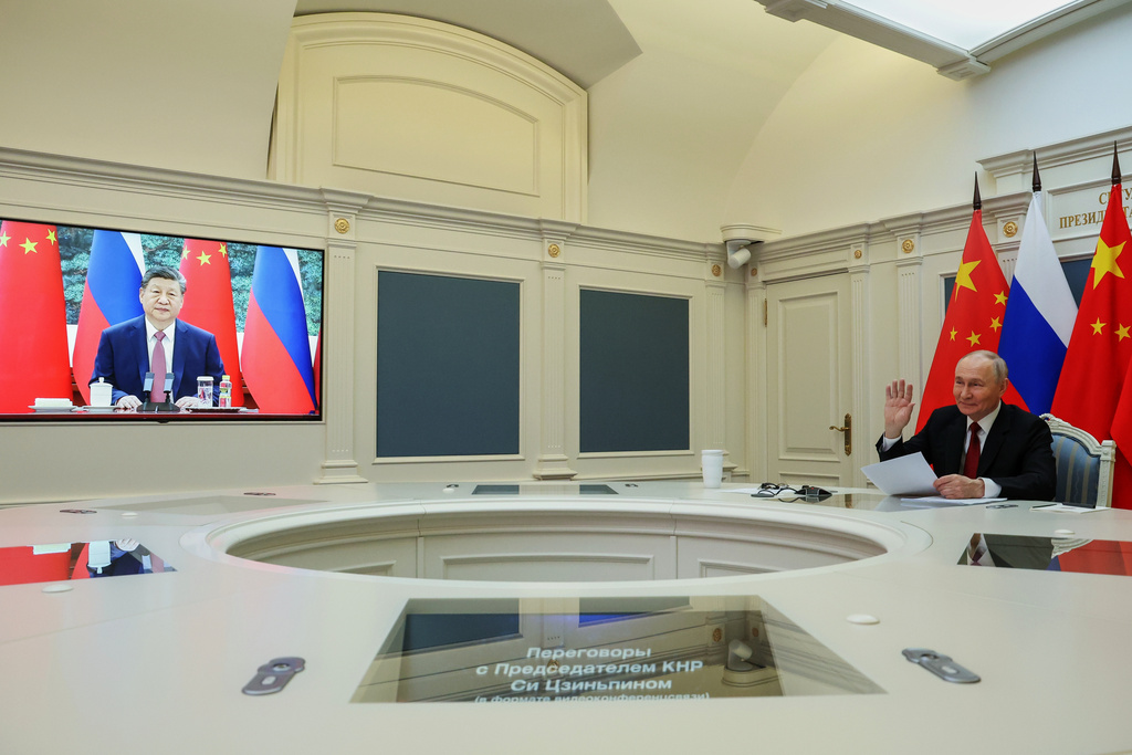 Russian President Vladimir Putin speaks with Chinese President Xi Jinping via videoconference at the Kremlin in Moscow, Wednesday, Feb. 4, 2026. (Vyacheslav Prokofyev/Sputnik, Kremlin Pool Photo via AP)