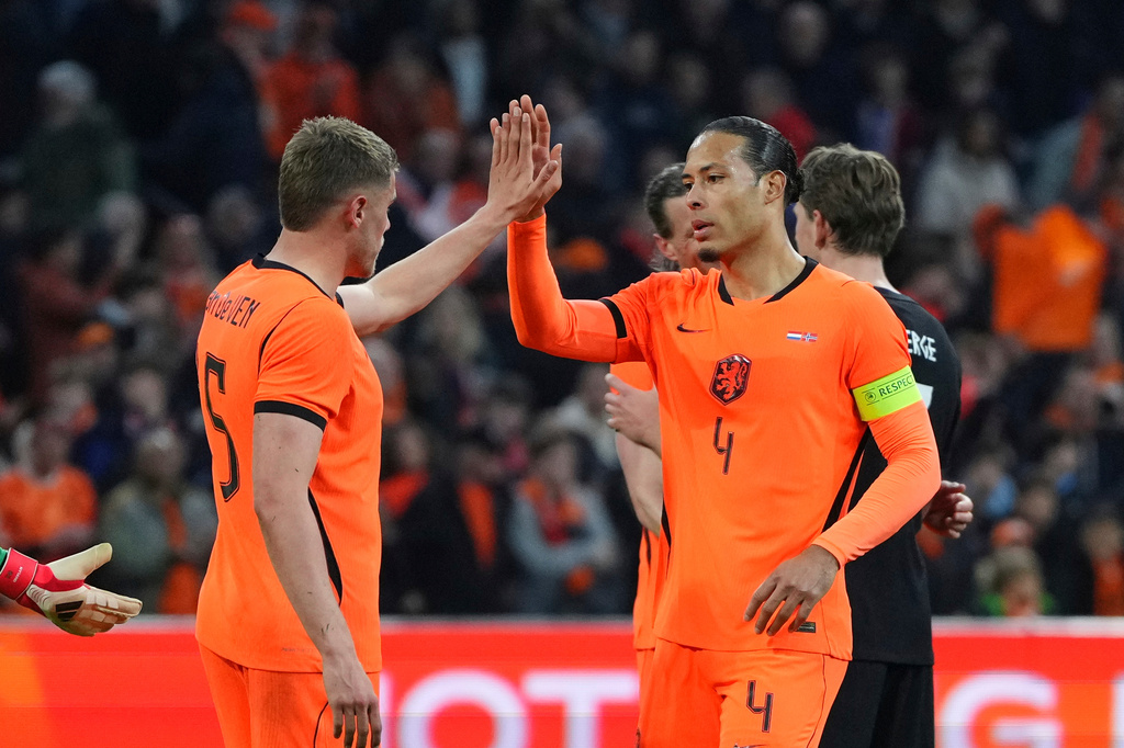 Netherlands' Virgil van Dijk, right, and Natan Ake celebrate after the international friendly soccer match between the Netherlands and Norway in Amsterdam, Netherlands, Friday, March 27, 2026. (AP Photo/Peter Dejong)