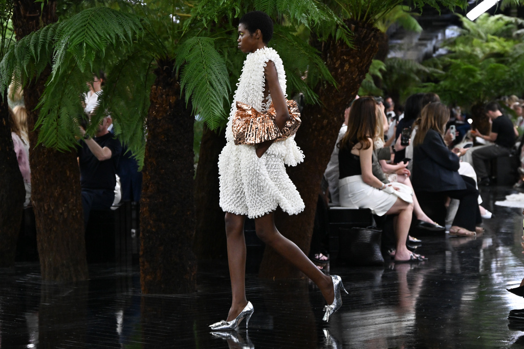 Models wear creations as part of the Christian Dior Haute Couture Fall/Winter 2026-2027 Women's collection presented in Paris, Monday, July 6, 2026. (AP Photo/Emma Da Silva)