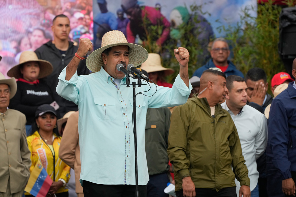 President Nicolas Maduro speaks during a rally marking the anniversary of the Battle of Santa Ines, which took place during Venezuela's 19th-century Federal War, in Caracas, Venezuela, Wednesday, Dec. 10, 2025. (AP Photo/Ariana Cubillos)