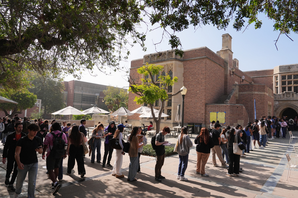Voters form a line at a polling station on the UCLA campus Tuesday, Nov. 4, 2025, in Los Angeles. (AP Photo/Jae C. Hong)