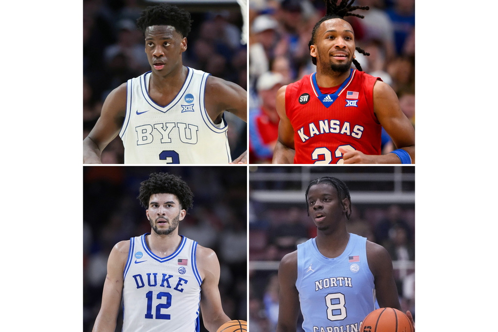 FILE - This photo combination shows, from top left, BYU forward AJ Dybantsa, March 19, 2026, in Portland, Ore., Kansas guard Darryn Peterson in Lawrence, Kan., March 7, 2026, Duke forward Cameron Boozer, March 21, 2026, in Greenville, S.C., and North Carolina forward Caleb Wilson in Stanford, Calif., Jan. 14, 2026. (AP Photo/Amanda Loman, Reed Hoffmann, Brynn Anderson, Jeff Chiu)