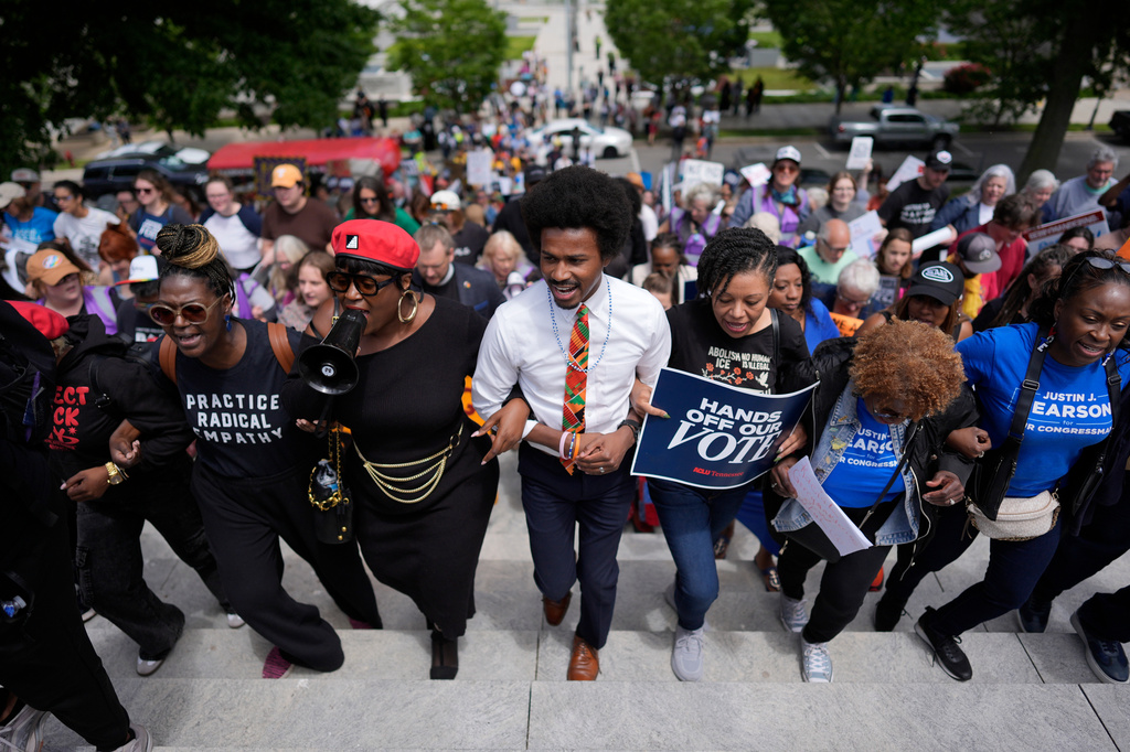 Rep. Justin J. Pearson, D-Memphis, center, marches with protesters before a special session of the state legislature to redraw U.S. Congressional voting maps, in Nashville, Tenn., Tuesday, May 5, 2026. (AP Photo/George Walker IV)
