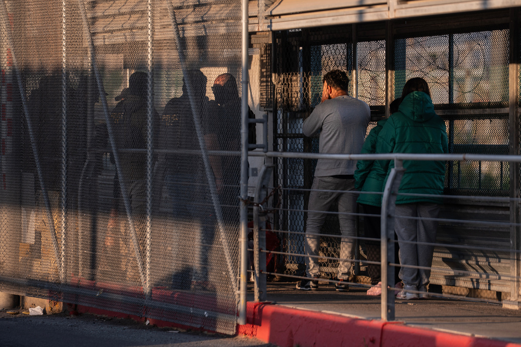 FILE - A group of undocumented migrants is deported by U.S. Immigration and Customs Enforcement agents across the McAllen–Hidalgo–Reynosa International Bridge in McAllen, Texas, March 13, 2026. (AP Photo/Felix Marquez, File)