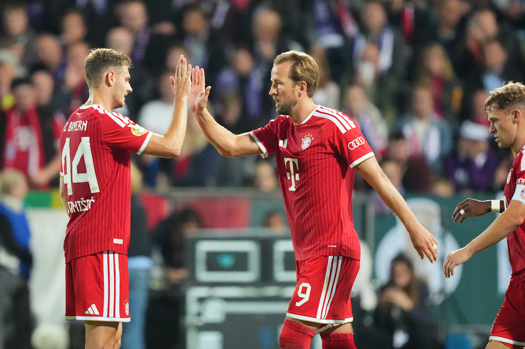 Bayern's Harry Kane, centre, celebrates after scoring during the German soccer cup match between VfL Osnabrueck and Bayern Munich in Osnabrueck, Germany, Wednesday, Sept. 2, 2026. (AP Photo/Martin Meissner)