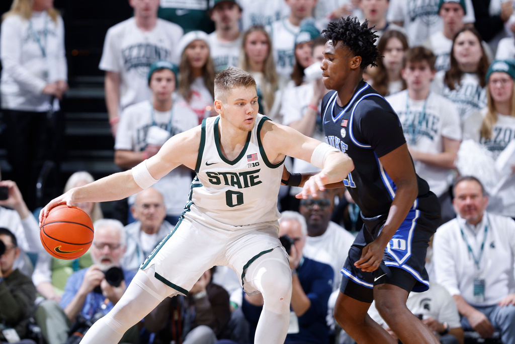 Michigan State forward Jaxon Kohler (0), left, maneuvers against Duke center Patrick Ngongba during the first half of an NCAA college basketball game, Saturday, Dec. 6, 2025, in East Lansing, Mich. (AP Photo/Al Goldis)