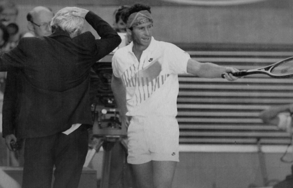 FILE - American tennis player John McEnroe argues with Grand Slam Supervisor Ken Farrar, at whom, MnEnroe later swore and was then disqualified from the Australian Open Tennis Championships in Melbourne, Australia, Jan. 21, 1990. (AP Photo/Rick Stevens, File)