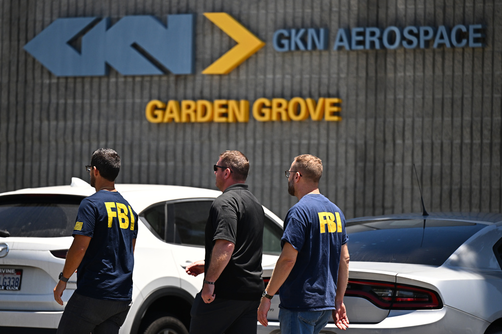 FBI agents work around GKN Aerospace in Garden Grove, Calif. on Wednesday, June 10, 2026. (AP Photo/William Liang)