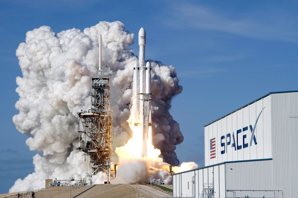 FILE - A Falcon 9 SpaceX heavy rocket lifts off from pad 39A at the Kennedy Space Center in Cape Canaveral, Fla., Tuesday, Feb. 6, 2018. (AP Photo/John Raoux, File)
