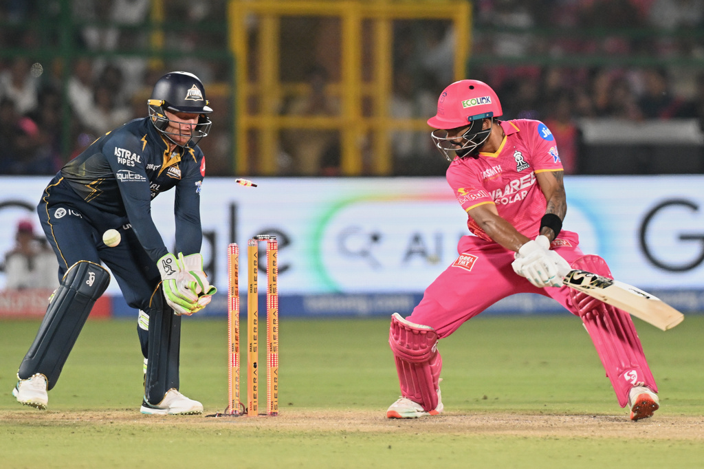Rajasthan Royals' Dhruv Jurel bowled out by Gujarat Titans' Rashid Khan during the Indian Premier League cricket match between Rajasthan Royals and Gujarat Titans in Jaipur, India, Saturday, May 9, 2026. (AP Photo/ Str)