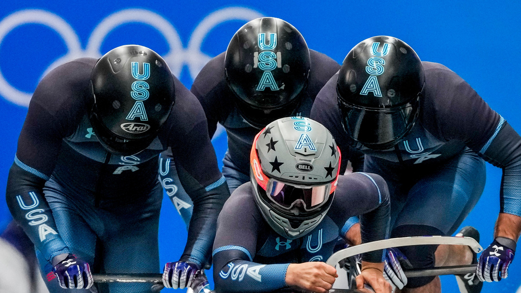 FILE - Hunter Church, Joshua Williamson, Kristopher Horn and Charlie Volker, of the United States, start the 4-man heat 1 at the 2022 Winter Olympics, Saturday, Feb. 19, 2022, in the Yanqing district of Beijing. (AP Photo/Dmitri Lovetsky,File)