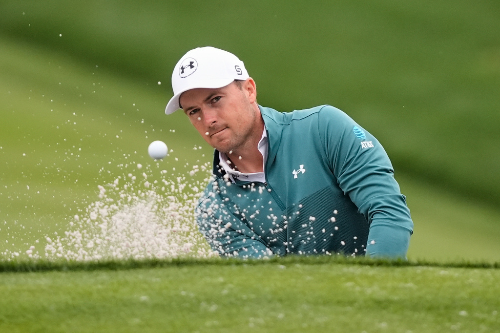 Jordan Spieth hits onto the 11th green during the second round of The Players Championship golf tournament Friday, March 13, 2026, in Ponte Vedra Beach, Fla. (AP Photo/Gerald Herbert)