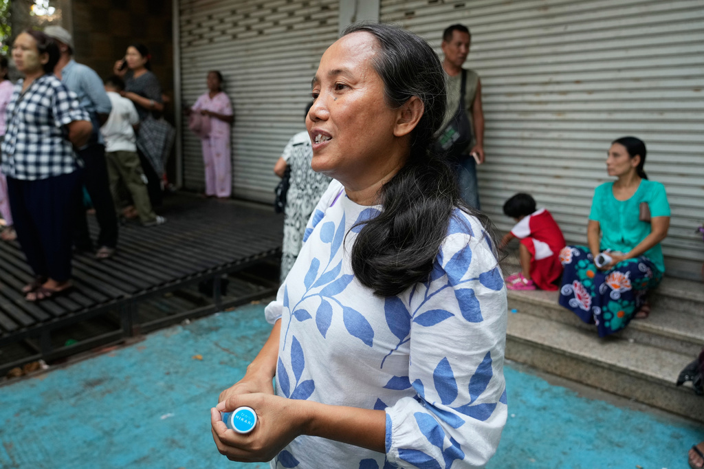 Filmmaker Shin Daewe talks to journalists after she was released from Insein Prison in Yangon, Myanmar, Friday, April 17, 2026, following Myanmar President's amnesty to mark the country's traditional new year. (AP Photo/Thein Zaw)