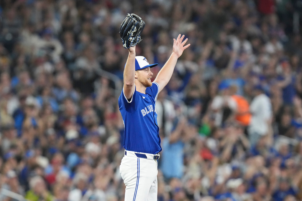 Toronto Blue Jays pitcher Eric Lauer (56) reacts after outfielder Nathan Lukes made a catch against the Boston Red Sox during the fifth inning of a baseball game in Toronto on Thursday, Sept. 25, 2025. (Chris Young/The Canadian Press via AP)