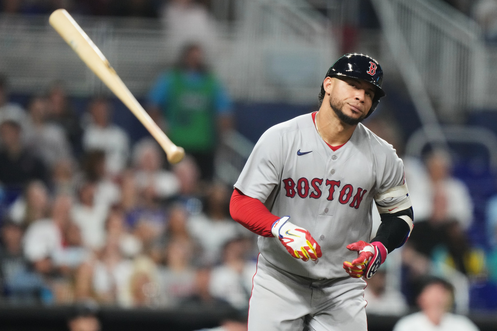 Boston Red Sox's Willson Contreras tosses his bat after flying out during the fourth inning of a baseball game against the Miami Marlins, Monday, Aug. 24, 2026, in Miami. (AP Photo/Lynne Sladky)