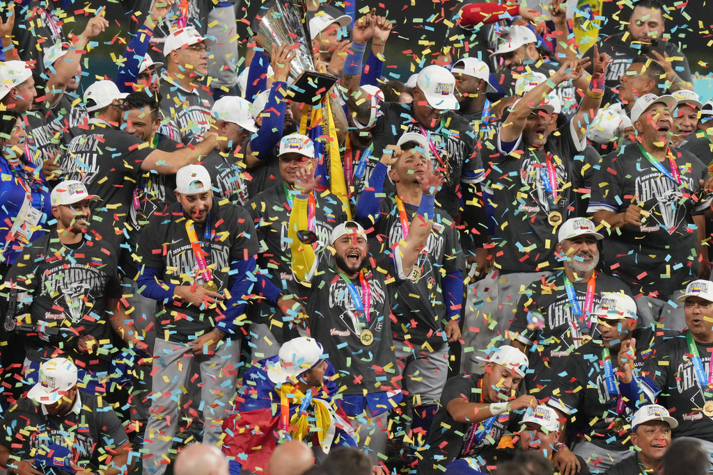 The Venezuela team celebrates after defeating the United States in the championship game of the World Baseball Classic, Tuesday, March 17, 2026, in Miami. (AP Photo/Lynne Sladky)