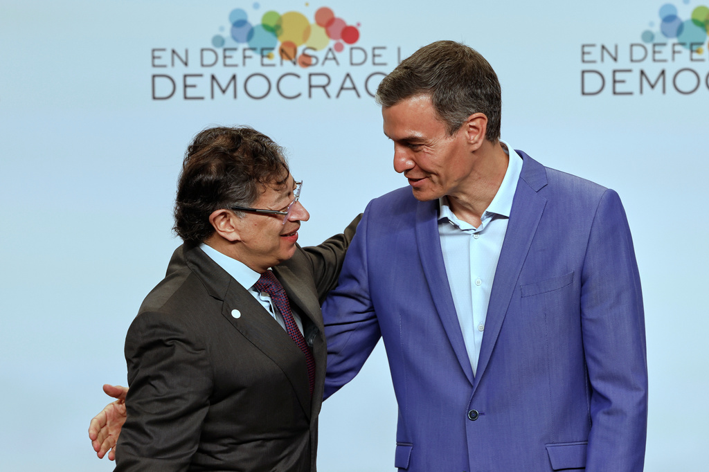 Spain's Prime Minister Pedro Sanchez, right, greets Colombia's President Gustavo Petro at the Meeting in Defence of Democracy summit in Barcelona, Spain, Saturday, April 18, 2026. (AP Photo/Joan Monfort)