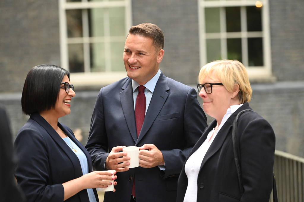 Britain's Home Secretary Shabana Mahmood, left, Defence Secretary Wes Streeting, center, and Secretary of State for Environment, Food and Rural Affairs Angela Eagle attend the first cabinet meeting held by Prime Minister Andy Burnham at 10 Downing Street, London, Tuesday July 21, 2026. (Eddie Mulholland/Pool Photo via AP)