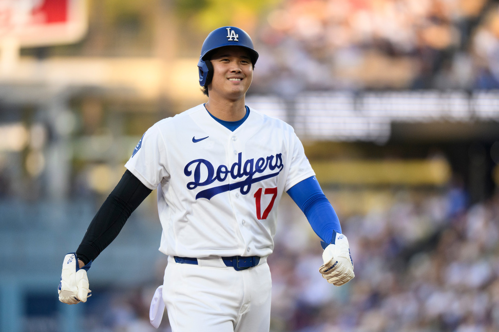 Los Angeles Dodgers starting pitcher Shohei Ohtani smiles during the first inning of a baseball game against the San Diego Padres in Los Angeles, Thursday, July 2, 2026. (AP Photo/Kyusung Gong)