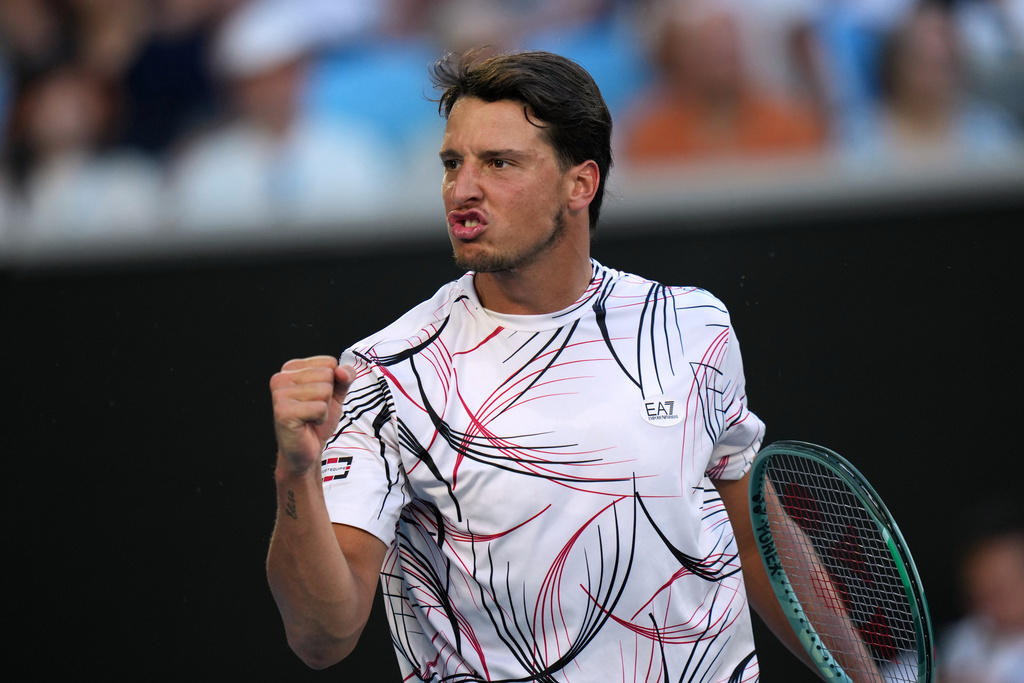 Luciano Darderi of Italy reacts as he plays against his compatriot Jannik Sinner during their fourth round match at the Australian Open tennis championship in Melbourne, Australia, Monday, Jan. 26, 2026. (AP Photo/Dar Yasin)