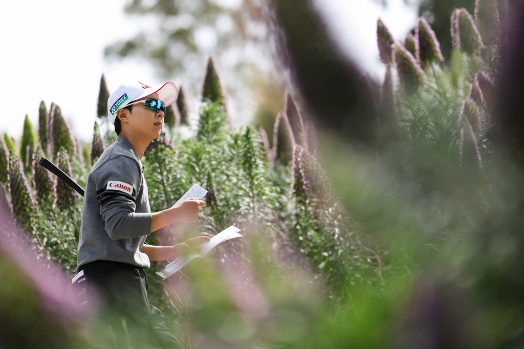 Hyo Joo Kim walks on a pathway to the third tee during the first round of the LPGA's JM Eagle LA Championship golf tournament at El Caballero Country Club, Thursday, April 16, 2026, in Los Angeles. (AP Photo/Jessie Alcheh)