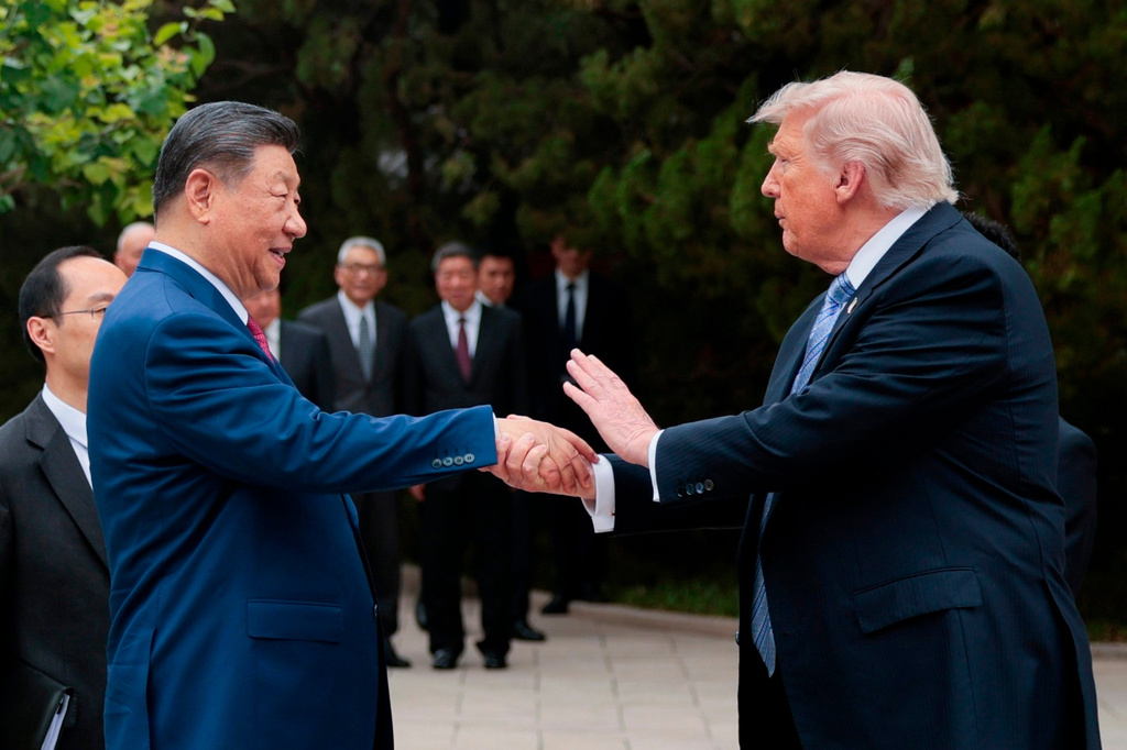 FILE - U.S. President Donald Trump, right, shakes hands with Chinese President Xi Jinping while leaving after a visit to the Zhongnanhai Garden in Beijing, Friday, May 15, 2026. (Evan Vucci/Pool Photo via AP, File)