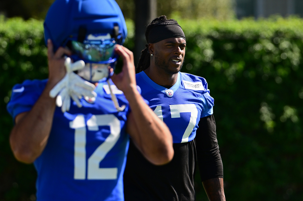 Los Angeles Rams wide receivers Puca Nacua, left, and Davante Adams, right, take the field during an NFL football training camp Monday, July 27, 2026, in Los Angeles. (AP Photo/Wally Skalij)