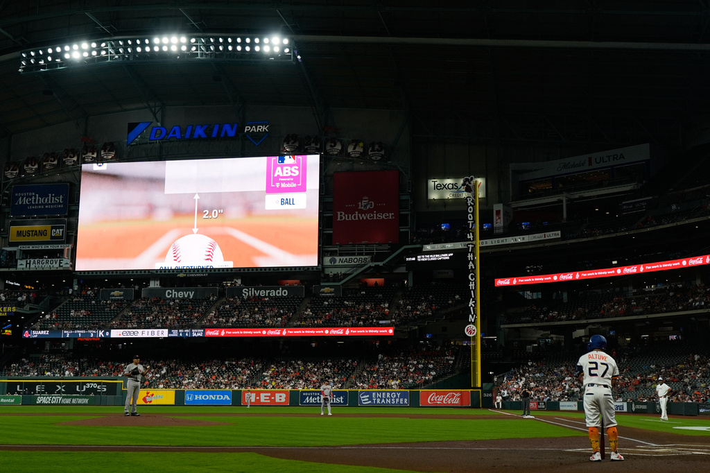 Houston Astros' Jose Altuve (27) watches a replay of the Automated Ball-Strike Challenge System (ABS) during the first inning of a baseball game against the Boston Red Sox in Houston, Monday, March 30, 2026. (AP Photo/Ashley Landis)