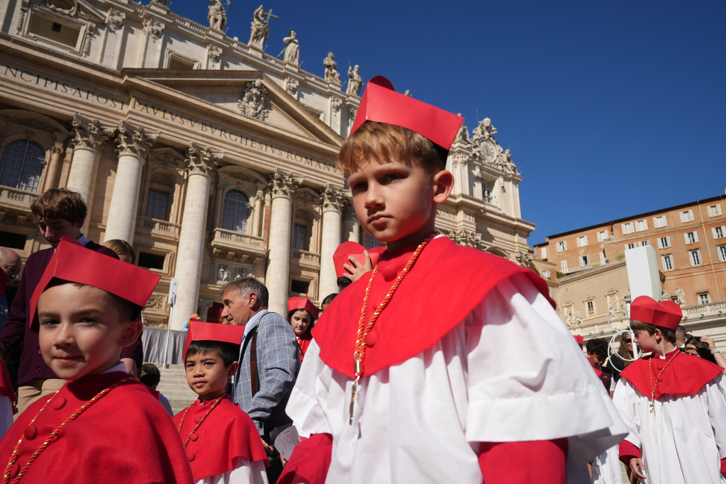 A group of children of Our Lady of Mount Carmel Academy of Chicago pose after attending the Pope Leo XIV weekly general audience in St. Peter's Square, at the Vatican, Wednesday, Oct. 8, 2025. (AP Photo/Andrew Medichini)