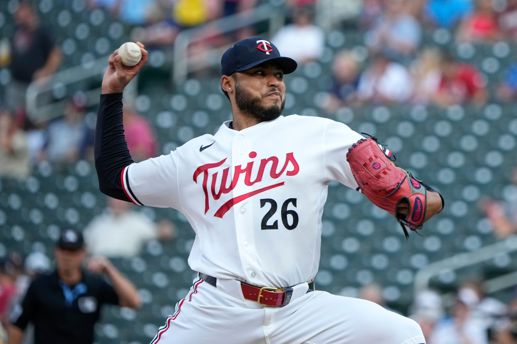 Minnesota Twins starting pitcher Taj Bradley (26) delivers during the first inning of a baseball game against the Kansas City Royals, Tuesday, July 28, 2026, in Minneapolis. (AP Photo/Joseph Scheller)