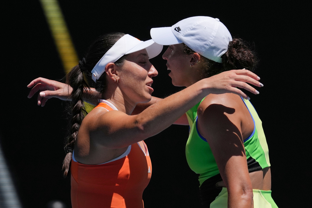 Jessica Pegula, left, of the U.S., is congratulated by her compatriot Madison Keys after winning their fourth round match at the Australian Open tennis championship in Melbourne, Australia, Monday, Jan. 26, 2026. (AP Photo/Mark Baker)