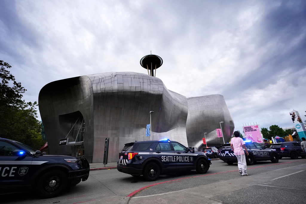 Police respond to a shooting at Seattle Center during the Bite of Seattle food festival Sunday, July 26, 2026, in Seattle, Wash. (AP Photo/Lindsey Wasson)