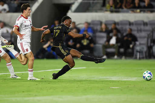 Los Angeles FC forward Jeremy Ebobisse (17) shoots as Toronto FC midfielder Alonso Coello, left, follows during the first half of an MLS soccer match, Wednesday, Oct. 8, 2025, in Los Angeles. (AP Photo/Jessie Alcheh) Los Angeles FC forward Jeremy Ebobisse (17) shoots as Toronto FC midfielder Alonso Coello, left, follows during the first half of an MLS soccer match, Wednesday, Oct. 8, 2025, in Los Angeles. (AP Photo/Jessie Alcheh)