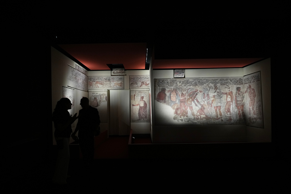 Reporters visit the frescoes, dating from 330–310 B.C., exhibited in the reconstruction of the François Tomb, an Etruscan tomb, at the Villa Giulia Etruscan Museum in Rome, Tuesday, June 30, 2026. (AP Photo/Alessandra Tarantino)